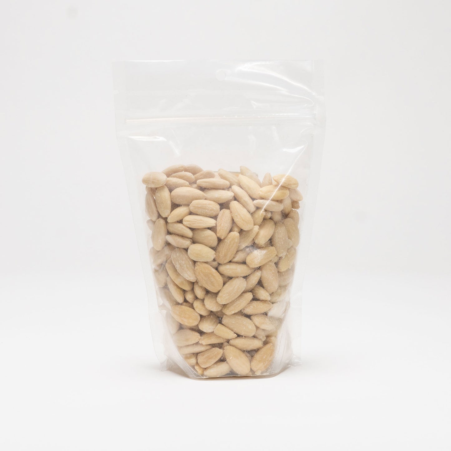 Back view of a clear bag of blanched almonds