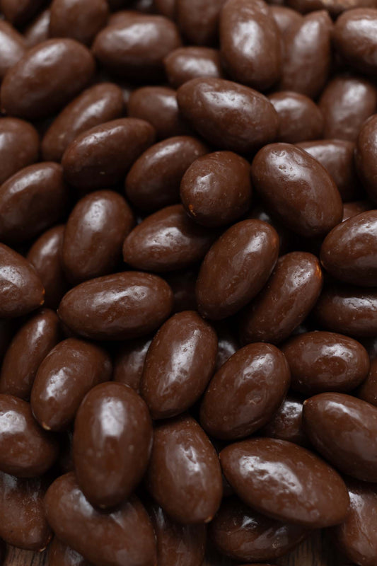 Close up of milk chocolate covered almonds