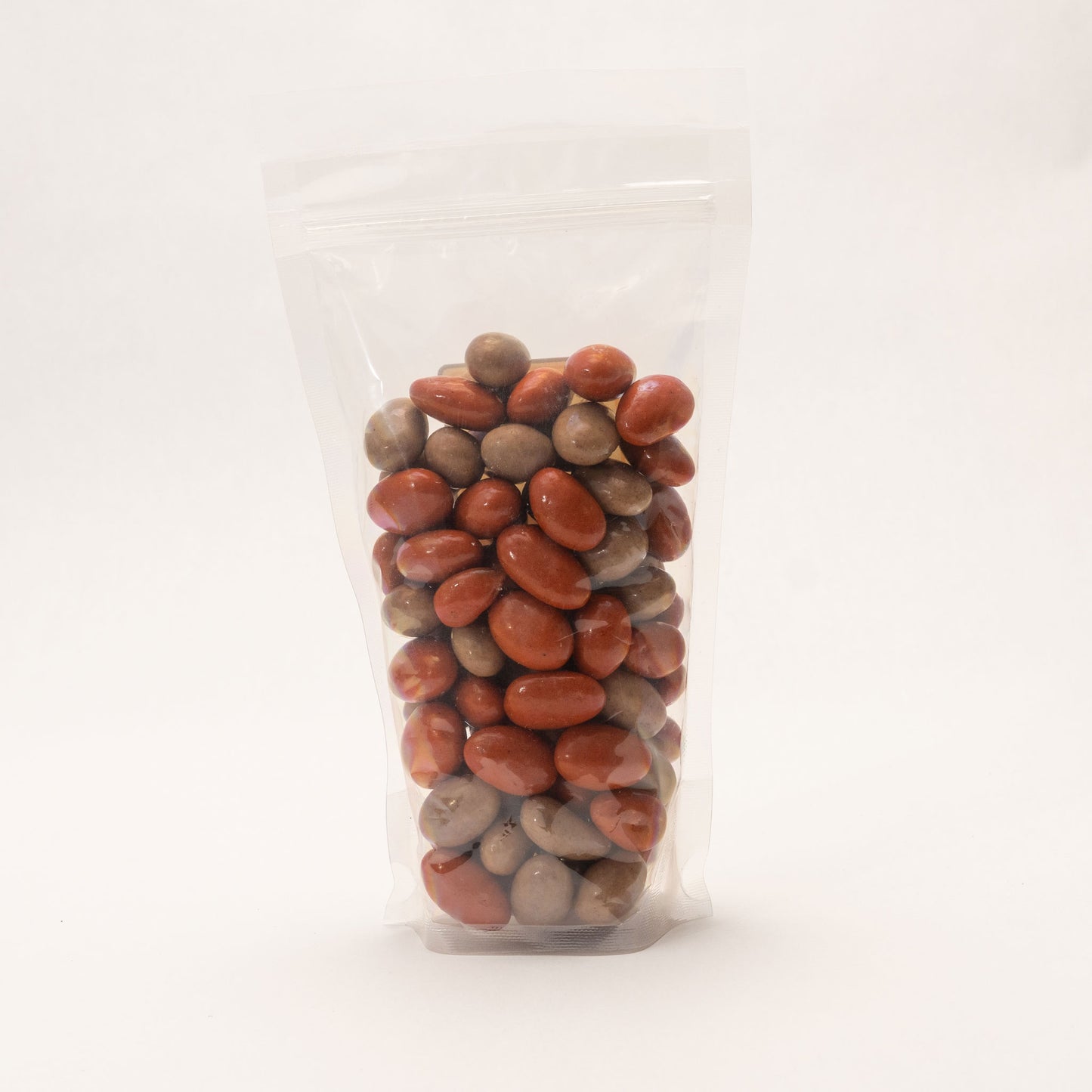 Back view of a clear bag filled with pumpkin spice almonds