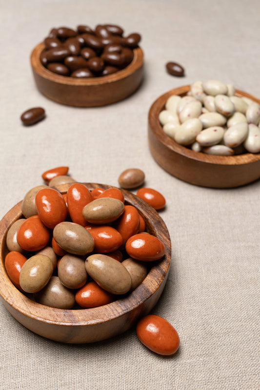 Wooden bowls filled with pumpkin spice almonds