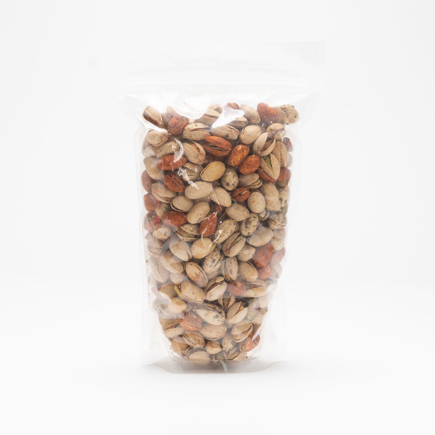 Back view of a clear bag of mixed pistachio nuts