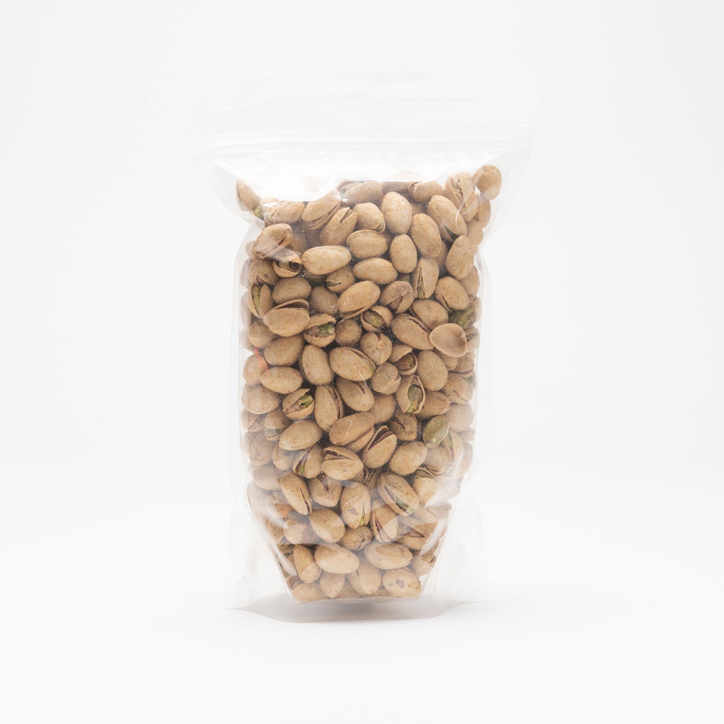 Back view of a clear bag of garlic pistachios