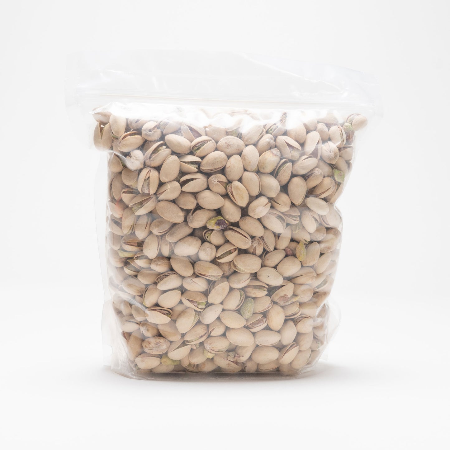 Back view of a clear bag of roasted and salted pistachios