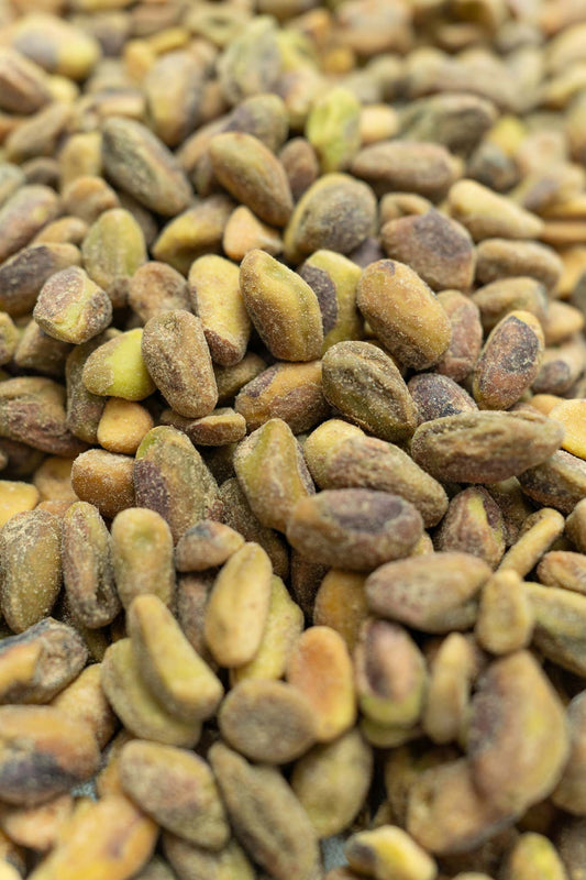 Close up of unshelled roasted and salted pistachios