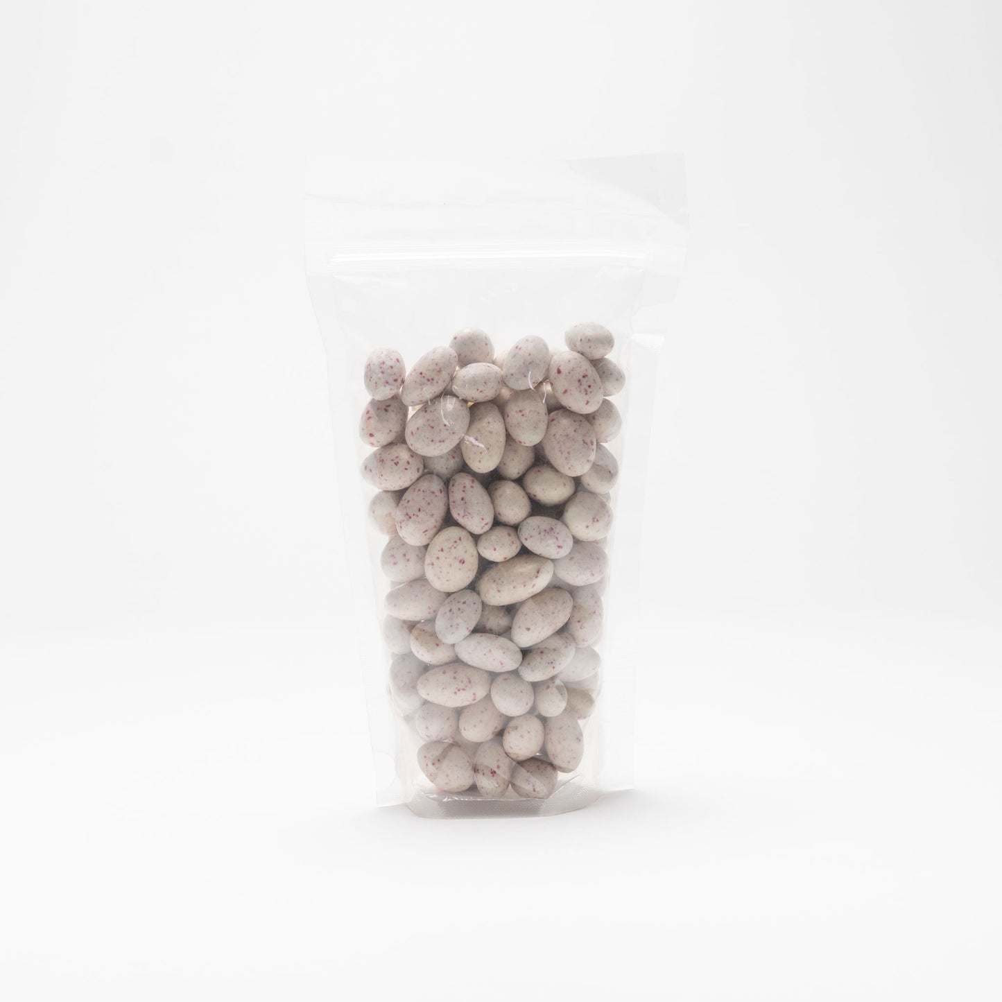 Back view of a clear bag of Aspen Mint Chocolate Almonds on a white background
