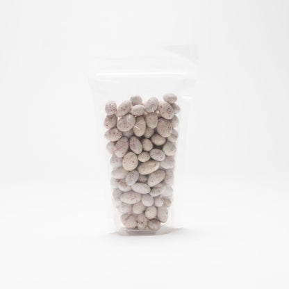 Back view of a clear bag of Aspen Mint Chocolate Almonds on a white background