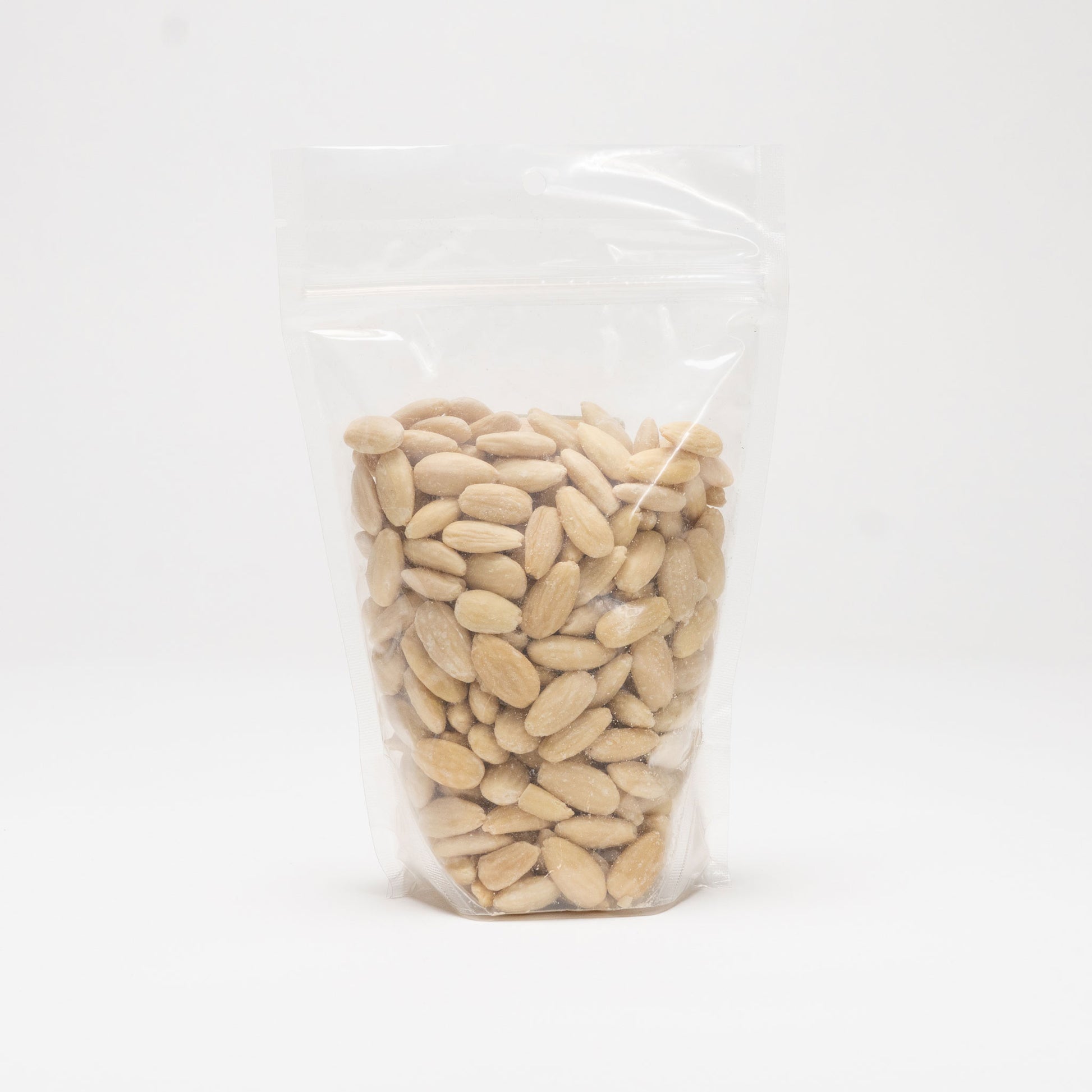 Back view of a clear bag of blanched almonds