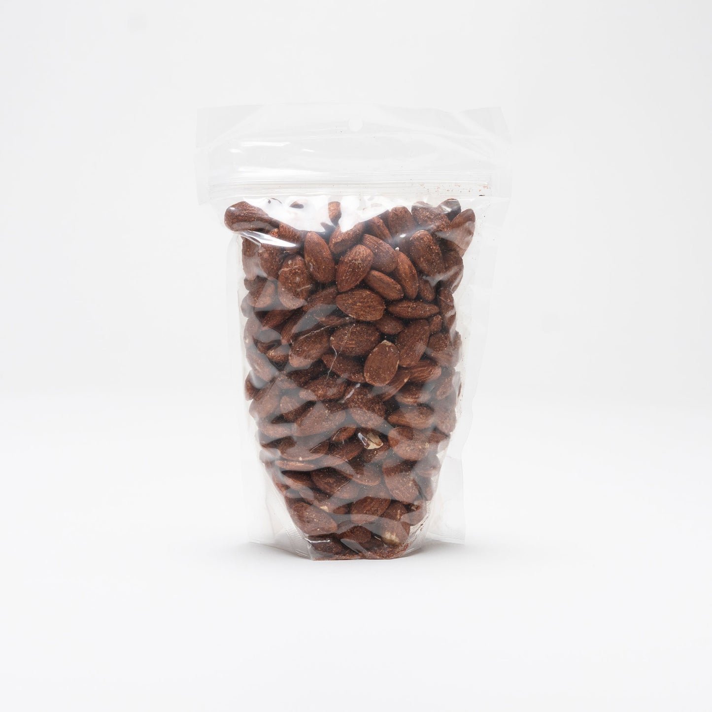 Back view of a clear bag of chili lemon almonds
