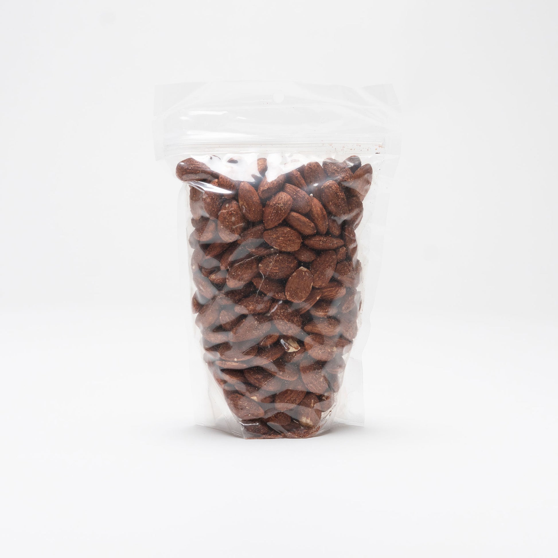 Back view of a clear bag of chili lemon almonds