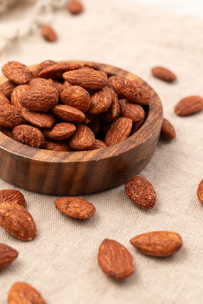 Wooden bowl filled with chili lemon almonds