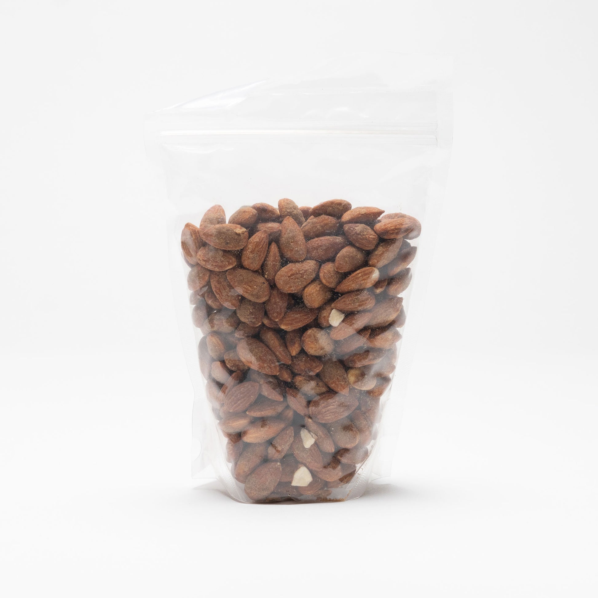 Back view of a clear bag of garlic almonds