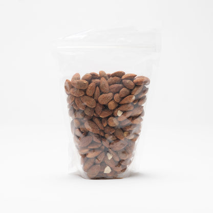 Back view of a clear bag of garlic almonds