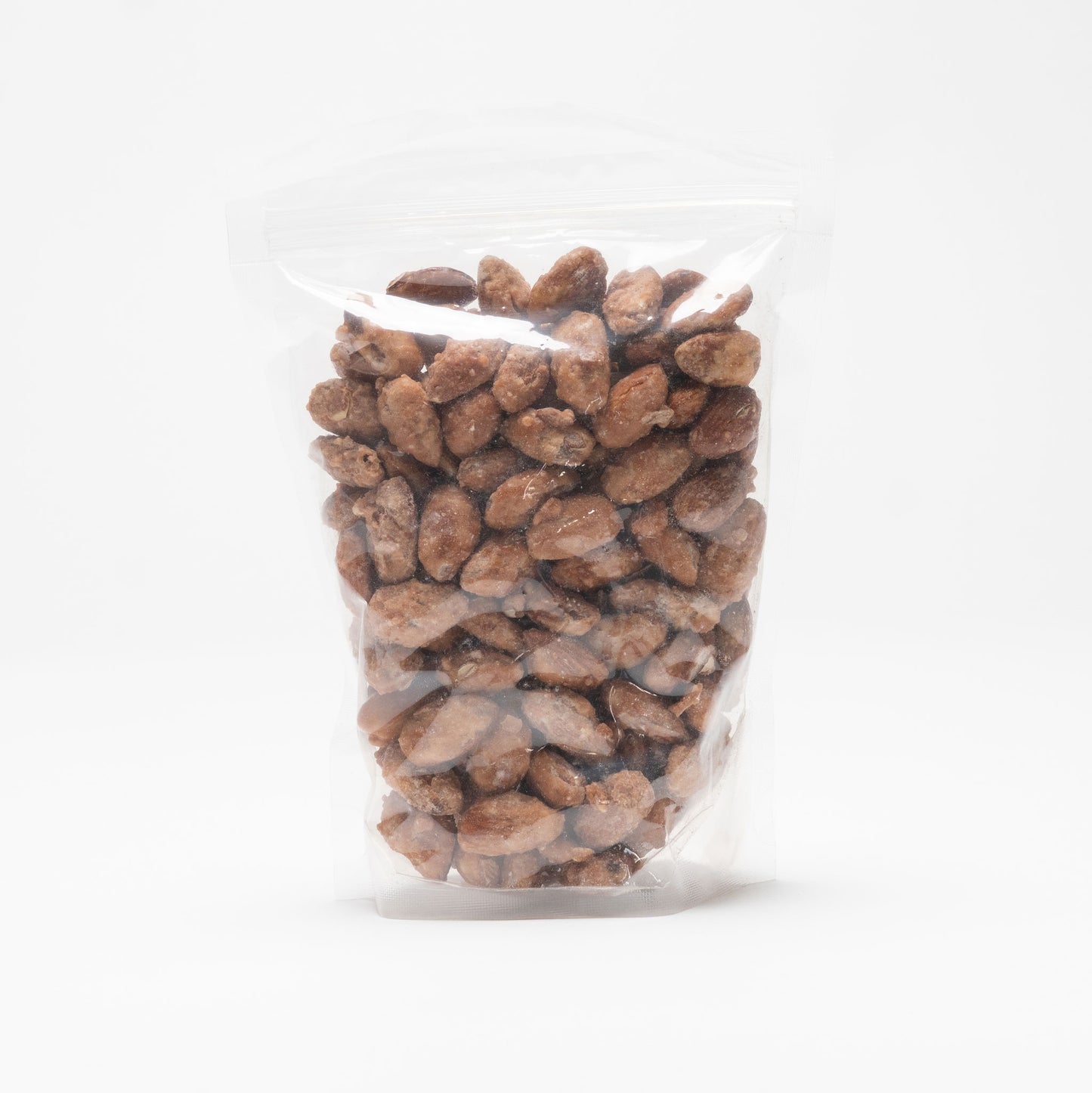 Back view of a clear bag of honey roasted almonds