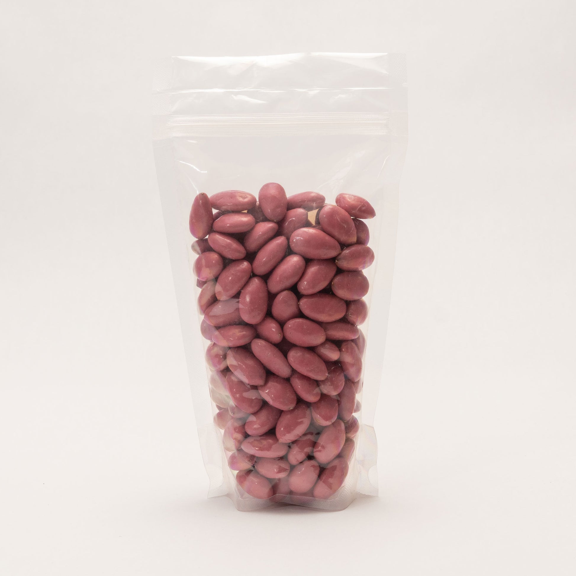 Back view of a clear bag filled with pomegranate yogurt almonds