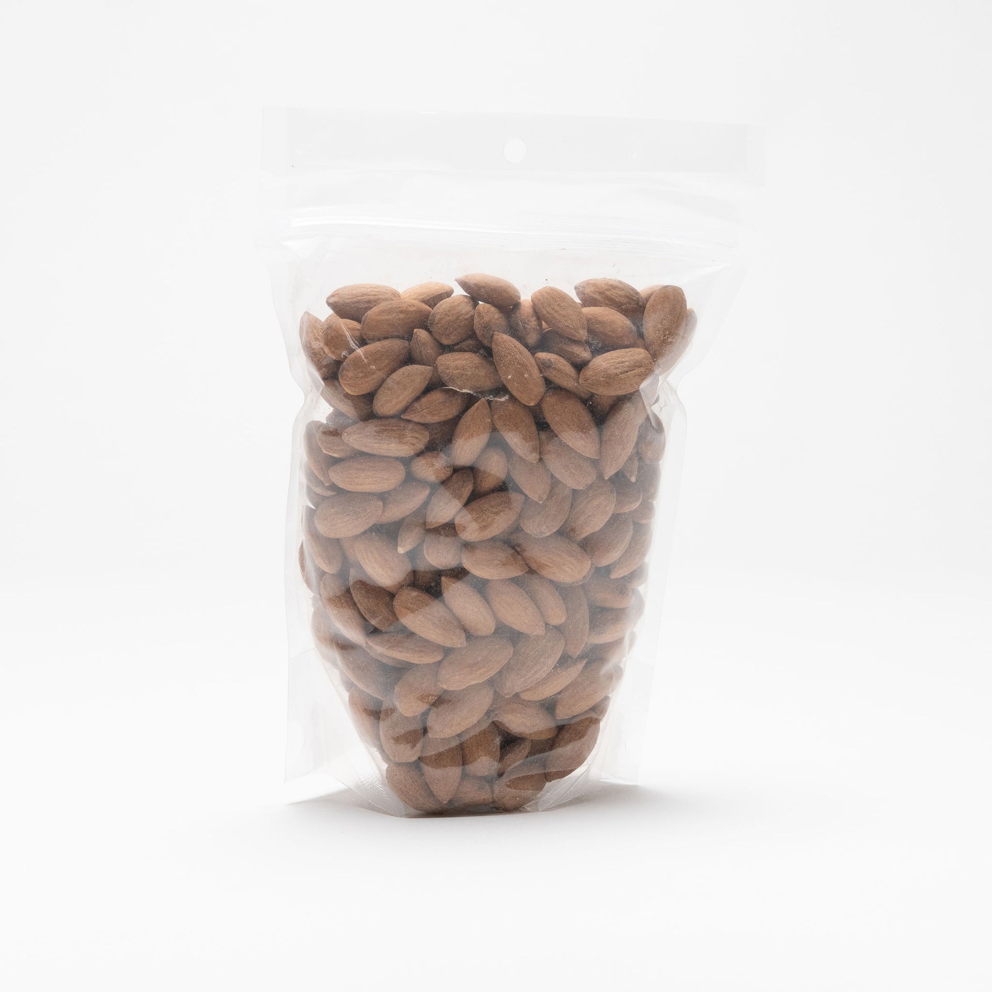 Back view of a clear bag of roasted and salted almonds
