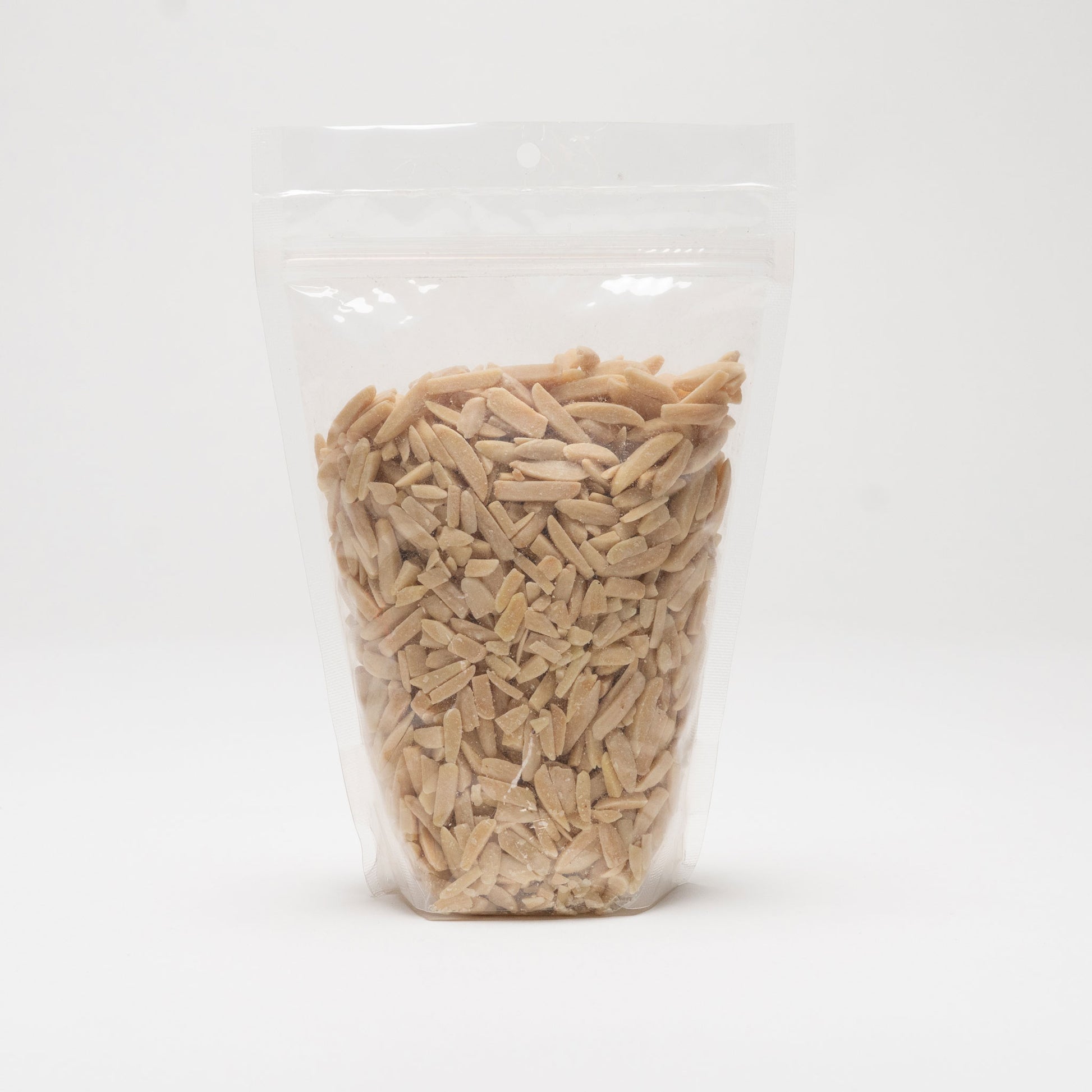 Back view of a clear bag of roasted slivered almonds