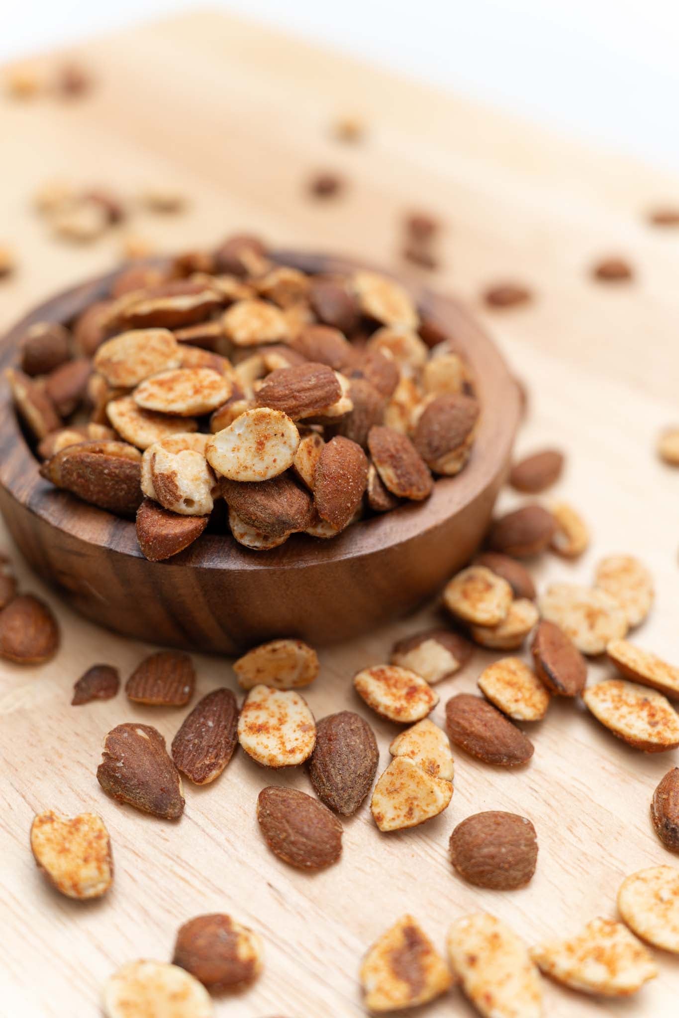 Wooden bowl filled with tangy tomato almonds