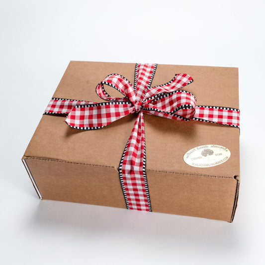 Brown gift box wrapped with a red checkered ribbon