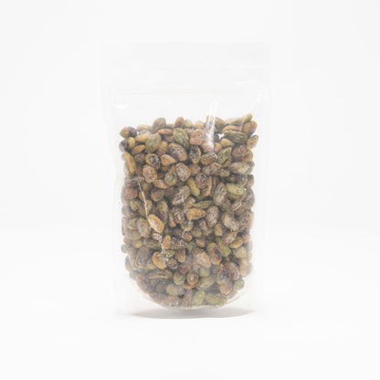 Back view of a clear bag of unshelled honey roasted pistachios