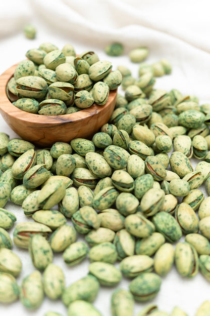 Wooden bowl filled with jalapeño pistachios