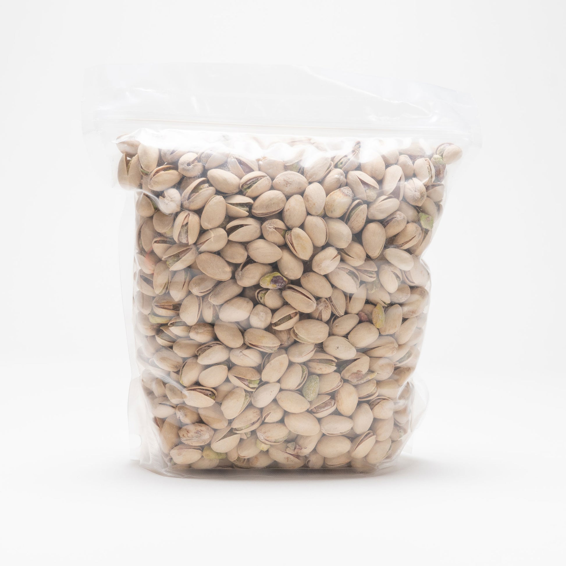 Back view of a clear bag of roasted and salted pistachios