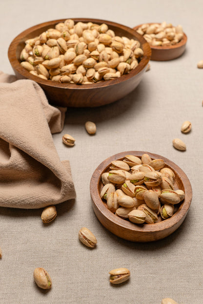 Wooden bowls filled with tequila flavored pistachios
