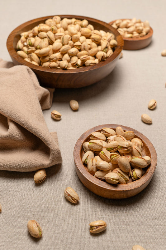 Wooden bowls filled with tequila flavored pistachios