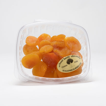 Clear container of dried apricots